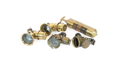 Lot 609 - Four Edwardian Brass and Metal-Cased Carbide...