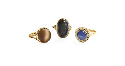 Lot 25 - Three Chatoyant Rings, including a synthetic...