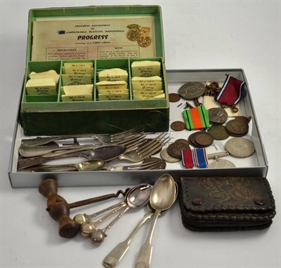 Lot 172 - A quantity of assorted silver forks, silver plated bowling spoons, watch repair parts, a corkscrew