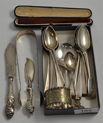 Lot 184 - A collection of George III and later silver flatware including Newcastle sugar tongs, cigarette...