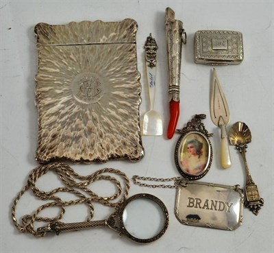 Lot 185 - A silver card case, a Georgian silver and coral rattle, a bookmark as a trowel, a Georgian...