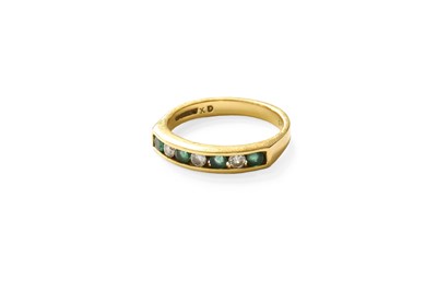 Lot 513 - An 18 Carat Gold Emerald and Diamond Half Hoop...