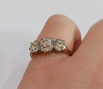 Lot 2277 - A Diamond Three Stone Ring the graduated old...
