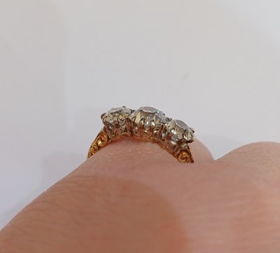 Lot 2277 - A Diamond Three Stone Ring the graduated old...
