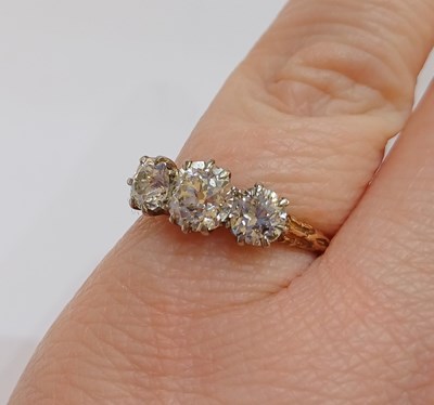 Lot 2277 - A Diamond Three Stone Ring the graduated old...