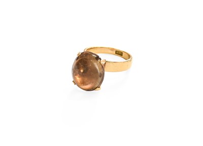 Lot 201 - A Smoky Quartz Ring, the oval cabochon smoky...