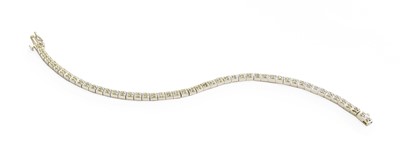 Lot 170 - A 9 Carat White Gold Diamond Line Bracelet,...