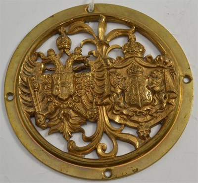 Lot 215 - A copy of a 19th century brass carriage door roundel, pierced and cast with the combined coats...