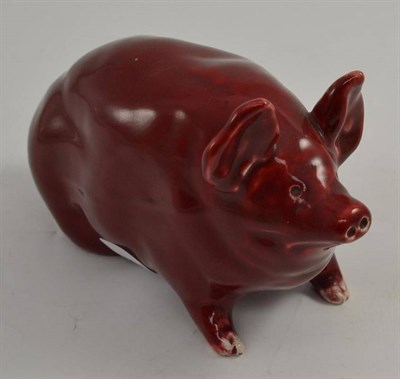 Lot 218 - A small Wemyss pig, with a claret ground, impressed Wemyss, 18cm long