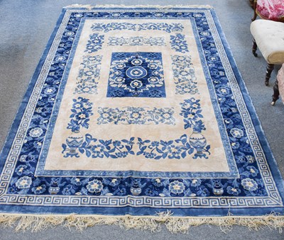 Lot 1100 - Chinese Silk Carpet, the ivory field with...