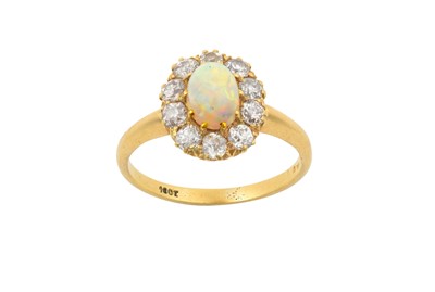 Lot 2339 - An Opal and Diamond Cluster Ring the oval...