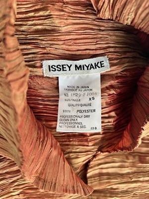 Lot 1054 - Issey Miyake Multi Pleated Rust and Gold Two...