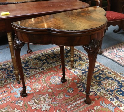 Lot 1523 - A 1920s Carved Mahogany Fold Over Card Table,...