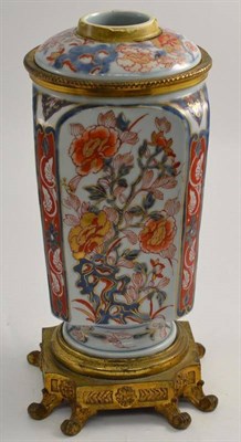 Lot 244 - A Japanese Imari porcelain oil lamp base with gilt metal mounts and removable font (lacking burner)