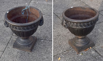 Lot 1271 - A Pair of Black Painted Cast Iron Garden Urns,...