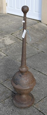 Lot 1280 - A Weathered Cast Metal Orb and Spike, Spire...