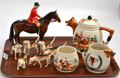 Lot 251 - A Beswick huntsman on brown horse, six hounds and a hunting ware teapot, milk jug and sucrier