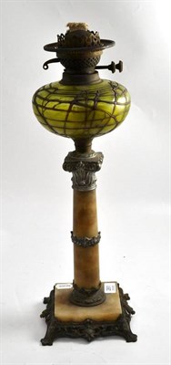 Lot 261 - A 19th century oil lamp, with a later font in the manner of Loetz, 52cm high