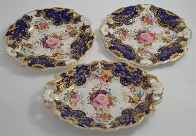 Lot 262 - Three 19th century porcelain dessert plates, painted with floral sprays, gilt and blue ground