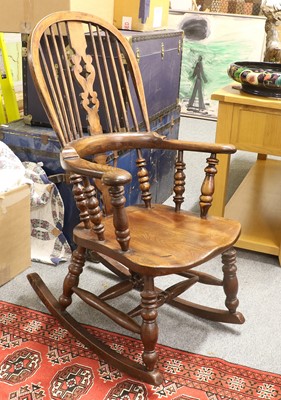 Lot 1485 - A 20th Century Elm Rocking Windsor Chair