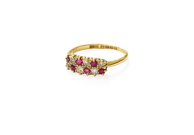 Lot 475 - An 18 Carat Gold Ruby and Diamond Two Row Ring,...