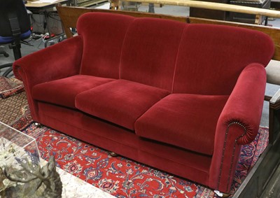 Lot 1332 - A Three Seater Scroll Arm Cottage Sofa, in red...