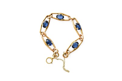 Lot 369 - A Blue Glass Bracelet, the oval openwork links...