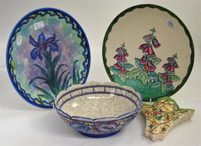 Lot 280 - Four pieces of Crown Ducal pottery designed by Charlotte Rhead, comprising a plaque decorated...