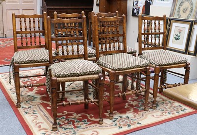 Lot 1375 - A Set of Six Elm Spindle Back Chairs