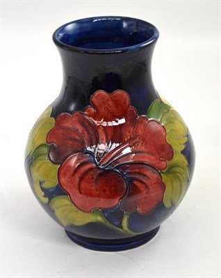 Lot 288 - A Walter Moorcroft pottery hibiscus pattern baluster vase, 25cm high