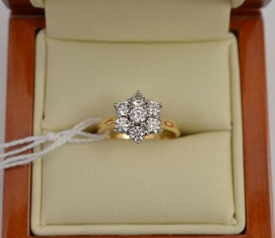 Lot 311 - A diamond set cluster ring