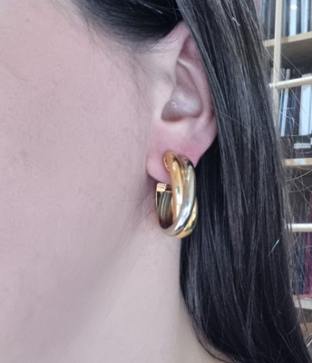 Lot 2251 - A Pair of Tri-Colour Trinity Creole Earrings,...