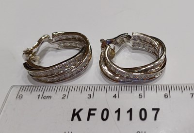 Lot 2255 - A Pair of Diamond Trinity Hoop Earrings, by...