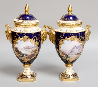 Lot 197 - A Pair of Coalport Porcelain Lidded Urns, with...