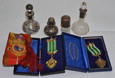 Lot 329 - Two silver top scent bottles, two overlay bottles and two silver gilt medals and ribbon of...