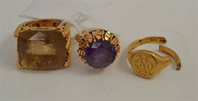 Lot 332 - A large smokey quartz dress ring, a signet ring stamped '18CT', (broken), and a synthetic...