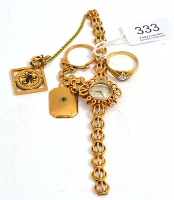 Lot 333 - A Lady's Movado wristwatch, a keyring, and a 9ct gold ring (3)