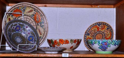 Lot 338 - Six items of Crown Ducal pottery designed by Charlotte Rhead comprising a charger decorated...