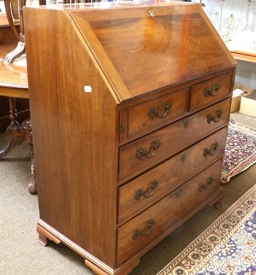 Lot 1494 - A George III Style Mahogany Bureau, with oak...