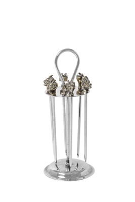 Lot 2122 - A Set of Six Parcel-Gilt Silver Plate Cocktail-Sticks and Stand