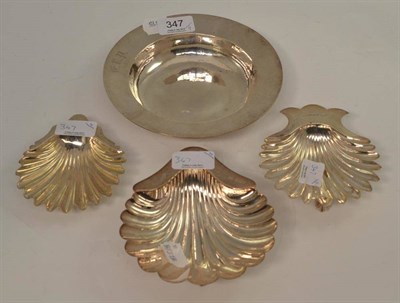 Lot 347 - Three silver shell butter dishes and silver circular dish (4)