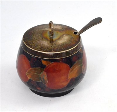 Lot 356 - A Moorcroft Pomegranate pattern preserve jar with plated spoon and lid