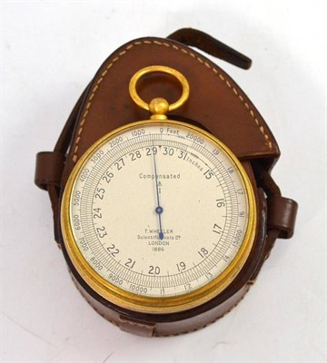 Lot 366 - A burnished brass pocket altimeter, leather case