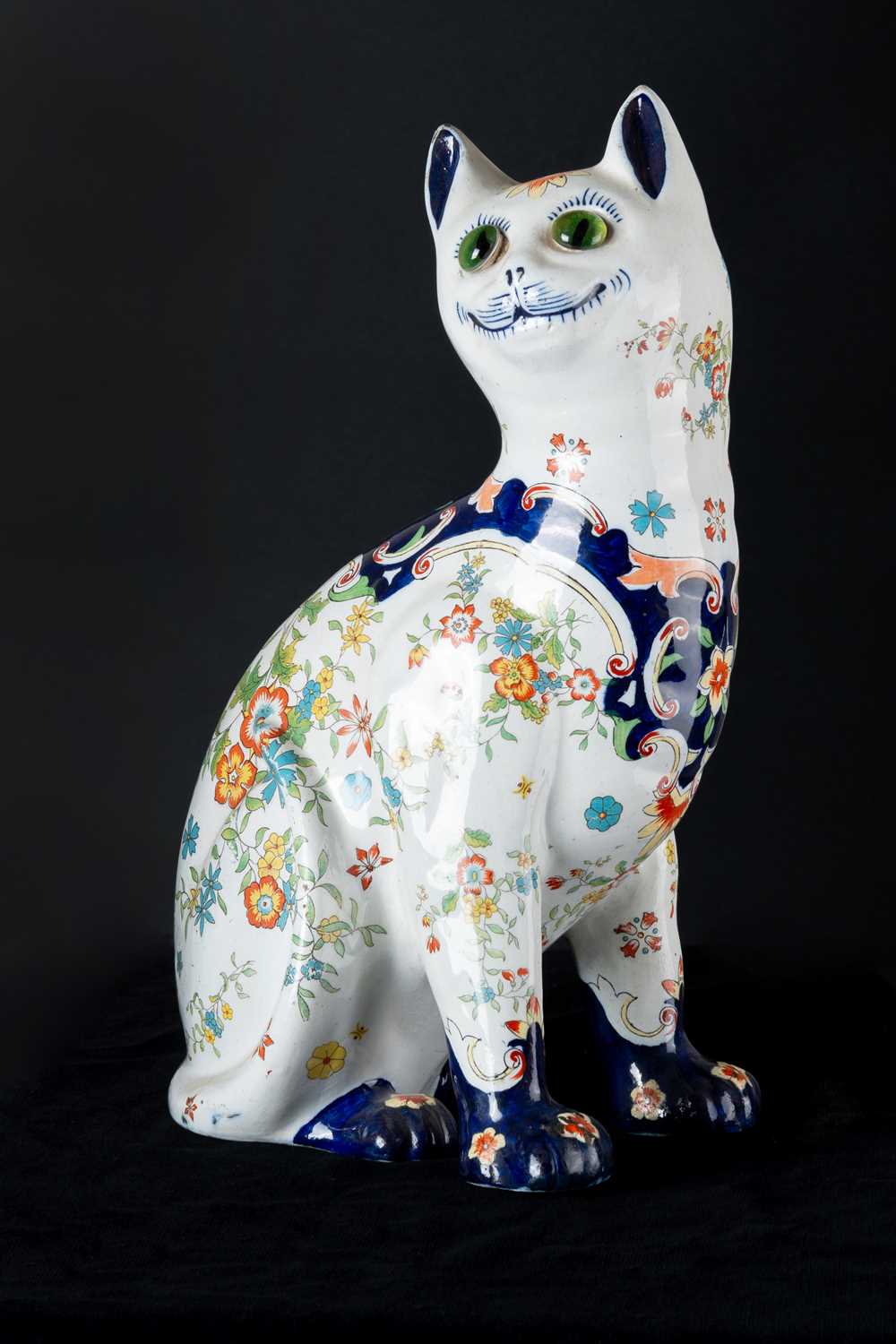 Lot 317 - A Continental Pottery Model of a Seated Cat,...