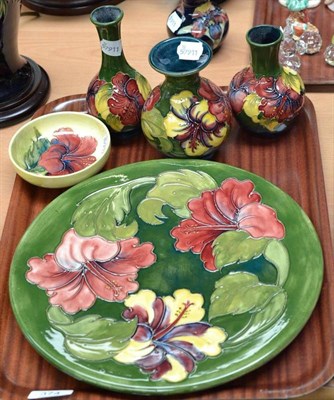 Lot 374 - Five pieces of Walter Moorcroft Hibiscus pattern: plate, 31cm, bowl, 11.5cm, three vases, 16cm,...