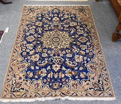 Lot 1072 - Nain Rug, the royal blue field centred by a...