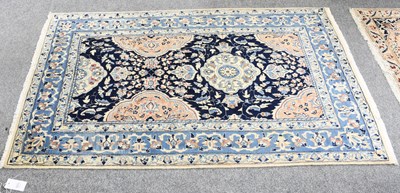 Lot 1071 - Nain Rug, the indigo field centred by cusped...