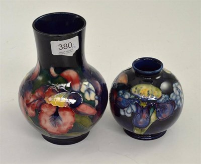 Lot 380 - Two Walter Moorcroft Orchid and Spring Flowers vases, impressed factory marks, taller vase with...