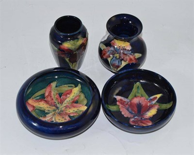 Lot 381 - Three pieces of Walter Moorcroft Orchid pattern: bowl, 11.5cm and two vases, 9cm and 10cm, and...