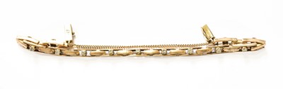 Lot 462 - A Diamond Bracelet, of yellow brick link form,...